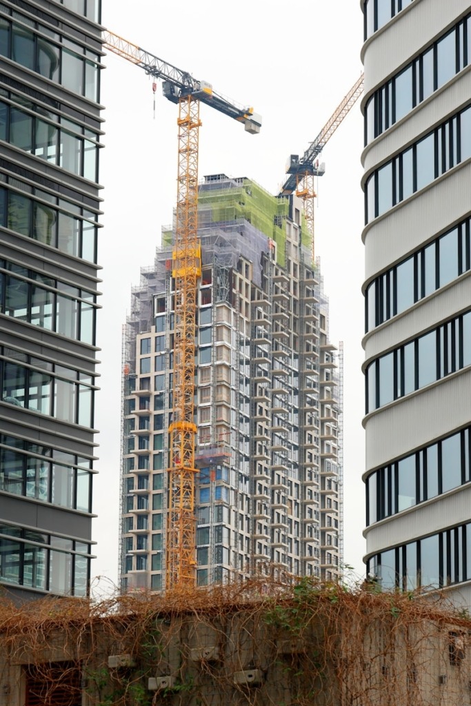 a couple of tall buildings sitting next to each other